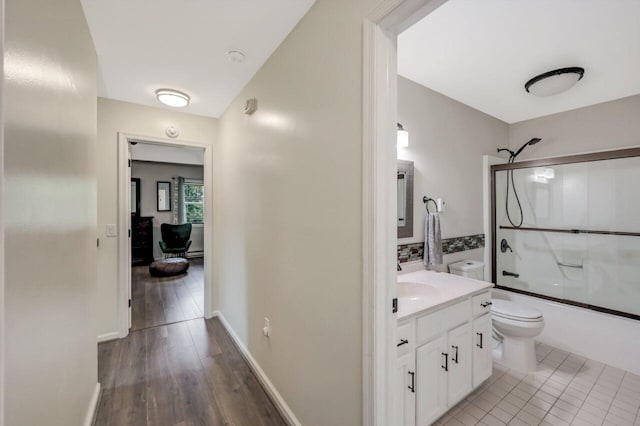 5117 Hounds Ear Rd, Tobyhanna, PA 18466 - full bathroom with vanity, combined bath / shower with glass door, and wood finished floors