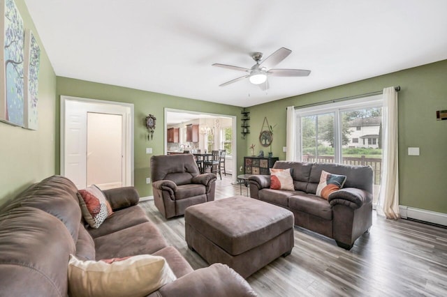 5117 Hounds Ear Rd, Tobyhanna, PA 18466 - living room featuring wood finished floors, healthy amount of natural light, and a ceiling fan