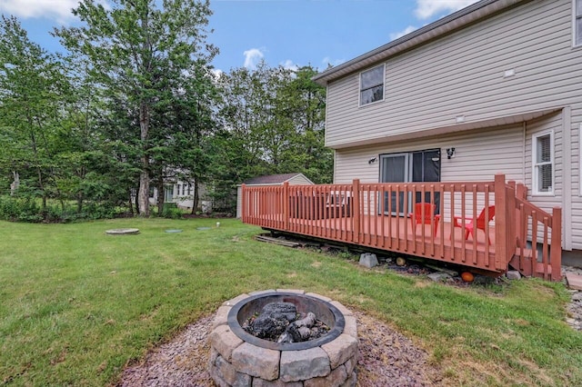 5117 Hounds Ear Rd, Tobyhanna, PA 18466 - view of grassy yard featuring an outdoor fire pit and a deck