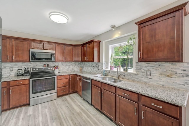 5117 Hounds Ear Rd, Tobyhanna, PA 18466 - kitchen featuring stainless steel appliances, decorative backsplash, and light stone countertops