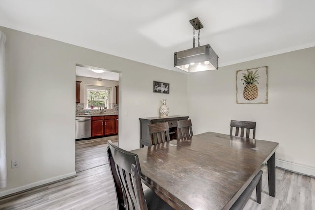 5117 Hounds Ear Rd, Tobyhanna, PA 18466 - dining room featuring light wood finished floors and baseboard heating