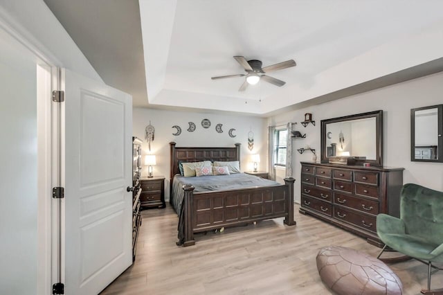 5117 Hounds Ear Rd, Tobyhanna, PA 18466 - bedroom with a raised ceiling, light wood-type flooring, and ceiling fan