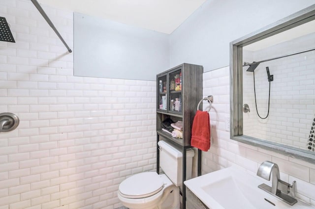 5117 Hounds Ear Rd, Tobyhanna, PA 18466 - bathroom featuring tile walls, tiled shower, decorative backsplash, and vanity