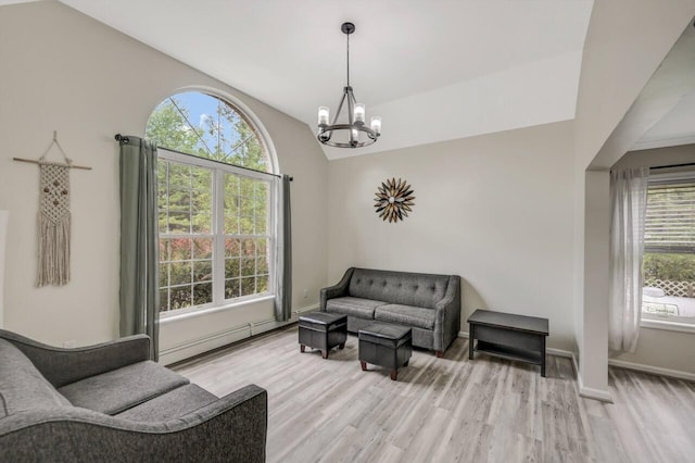 5117 Hounds Ear Rd, Tobyhanna, PA 18466 - living area featuring a chandelier, light wood-type flooring, and lofted ceiling