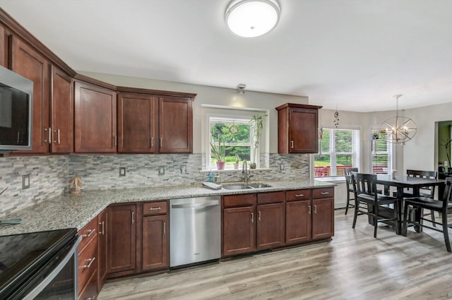 5117 Hounds Ear Rd, Tobyhanna, PA 18466 - kitchen with stainless steel appliances, light wood finished floors, and plenty of natural light