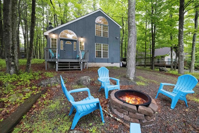203 Wyomissing Dr, Pocono Lake, PA 18347 - rear view of property featuring a fire pit, a wooden deck, and crawl space