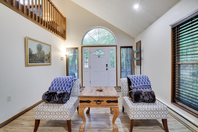 203 Wyomissing Dr, Pocono Lake, PA 18347 - foyer with light wood-style flooring, baseboards, and high vaulted ceiling