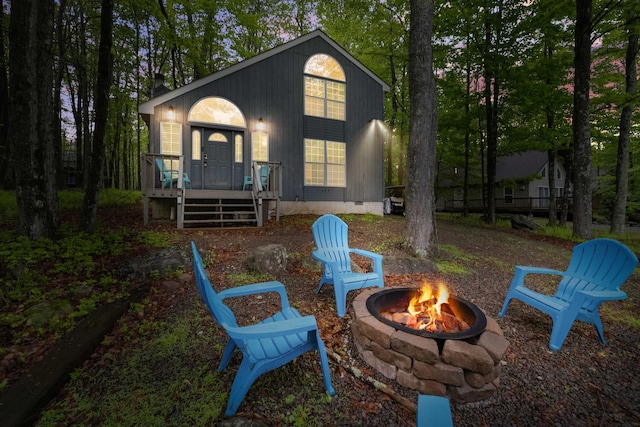 203 Wyomissing Dr, Pocono Lake, PA 18347 - rear view of house featuring a fire pit and crawl space