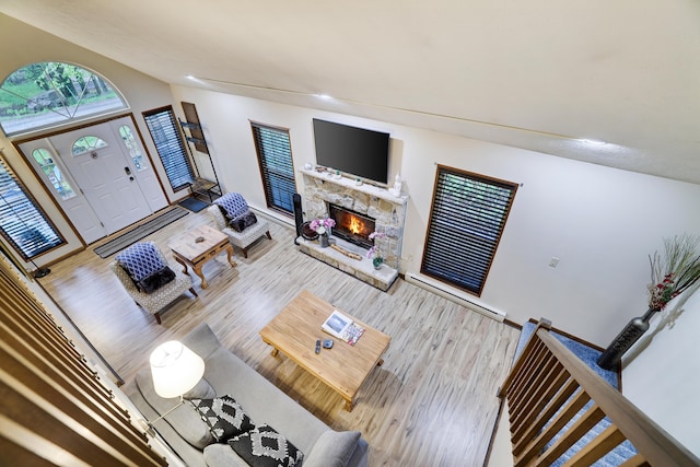 203 Wyomissing Dr, Pocono Lake, PA 18347 - living area with wood finished floors, a stone fireplace, baseboards, and recessed lighting