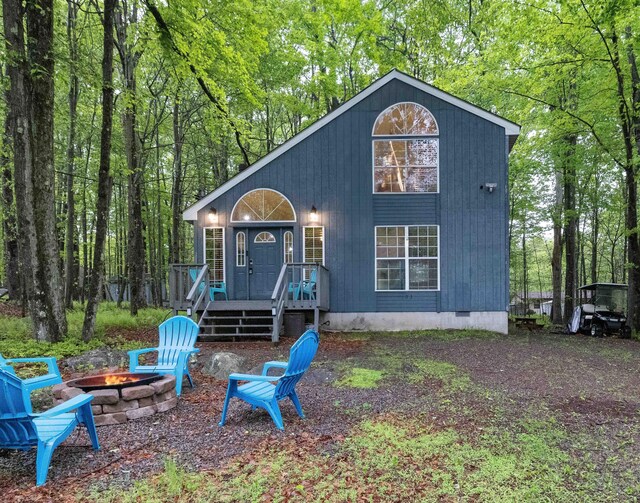 203 Wyomissing Dr, Pocono Lake, PA 18347 - view of front of house featuring a fire pit, crawl space, and a deck