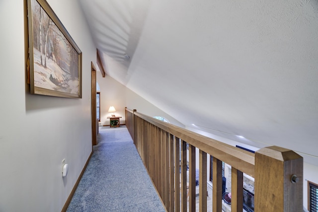 203 Wyomissing Dr, Pocono Lake, PA 18347 - hall featuring vaulted ceiling, carpet, an upstairs landing, and baseboards