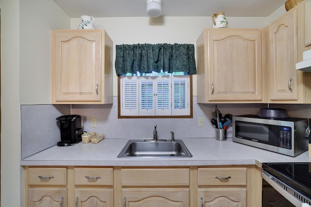 203 Wyomissing Dr, Pocono Lake, PA 18347 - kitchen with light brown cabinets, stainless steel microwave, a sink, and light countertops