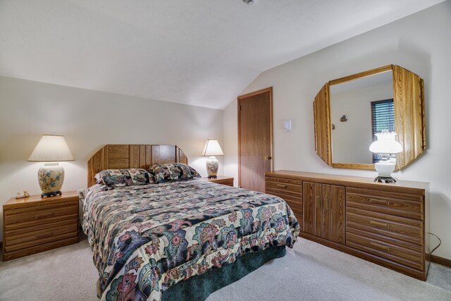 203 Wyomissing Dr, Pocono Lake, PA 18347 - bedroom with light colored carpet and vaulted ceiling
