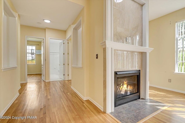 hall with hardwood / wood-style floors