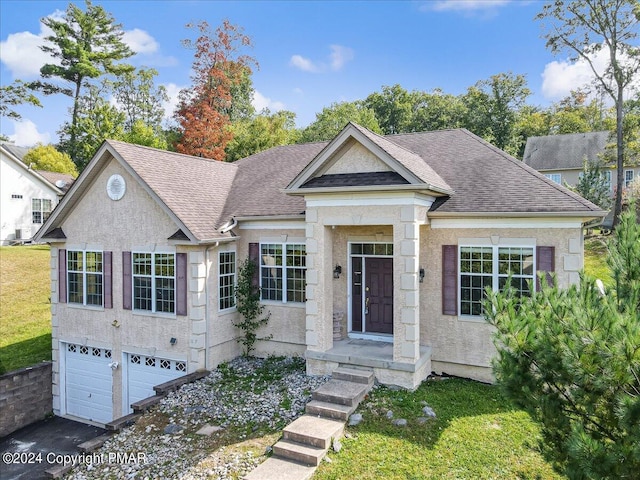 view of front of property with a garage