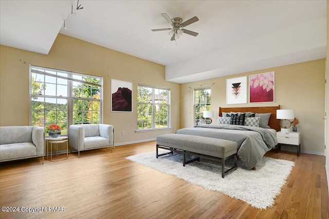 bedroom featuring hardwood / wood-style flooring and ceiling fan