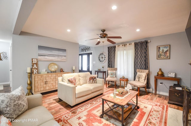 living area with ceiling fan, light wood-type flooring, baseboards, and recessed lighting