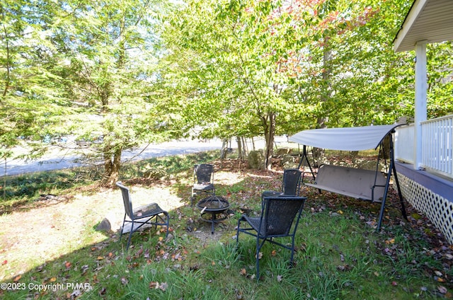 view of yard with a fire pit