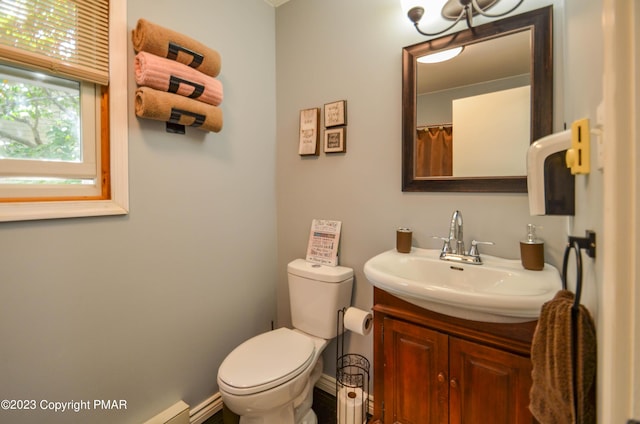 bathroom featuring toilet and vanity