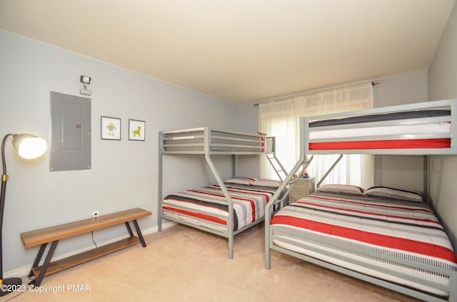 bedroom featuring electric panel, baseboards, and light colored carpet