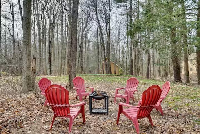 view of yard with a fire pit