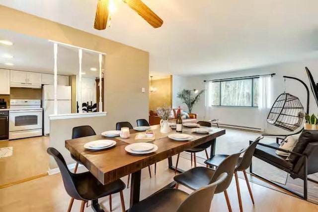 dining space with baseboard heating