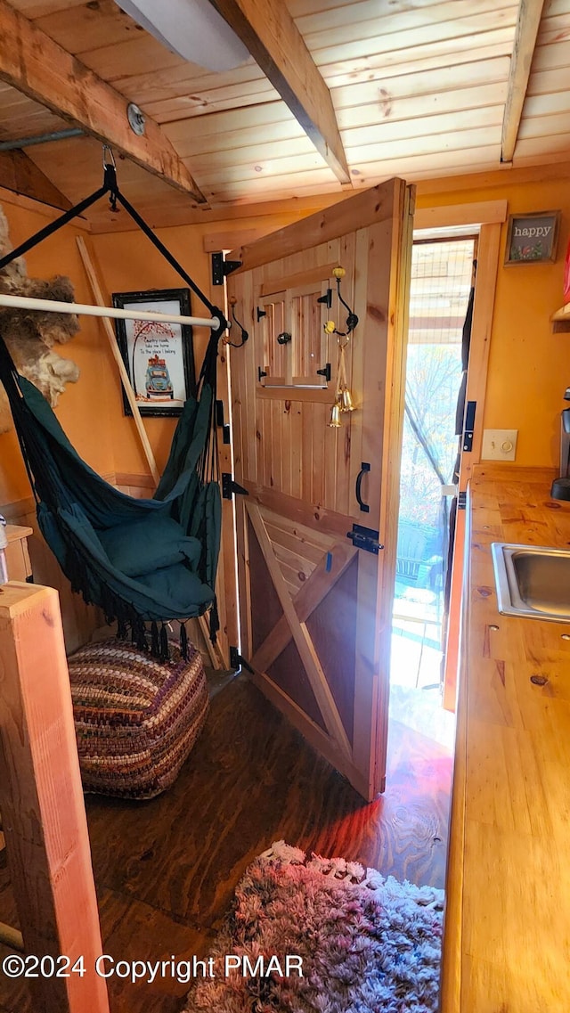 2124 Meadowlark Cir, Bushkill, PA 18324 - staircase with wood finished floors and a wooden ceiling with exposed beams