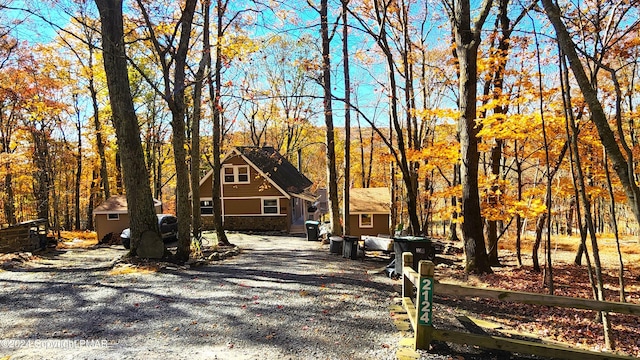 2124 Meadowlark Cir, Bushkill, PA 18324 - chalet / cabin with a shed and stone siding