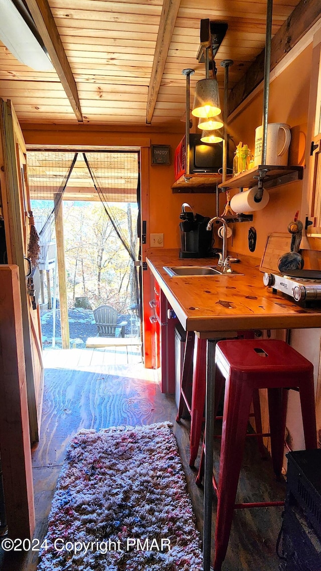 2124 Meadowlark Cir, Bushkill, PA 18324 - kitchen with butcher block countertops, a wood ceiling with exposed beams, and open shelves