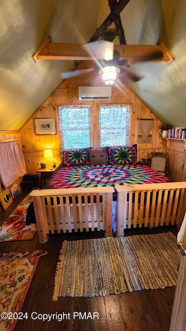 2124 Meadowlark Cir, Bushkill, PA 18324 - bedroom featuring wood walls, a wall mounted air conditioner, lofted ceiling, and hardwood / wood-style floors