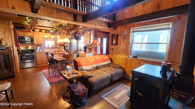 2124 Meadowlark Cir, Bushkill, PA 18324 - living area with wooden walls, wood finished floors, and a baseboard radiator