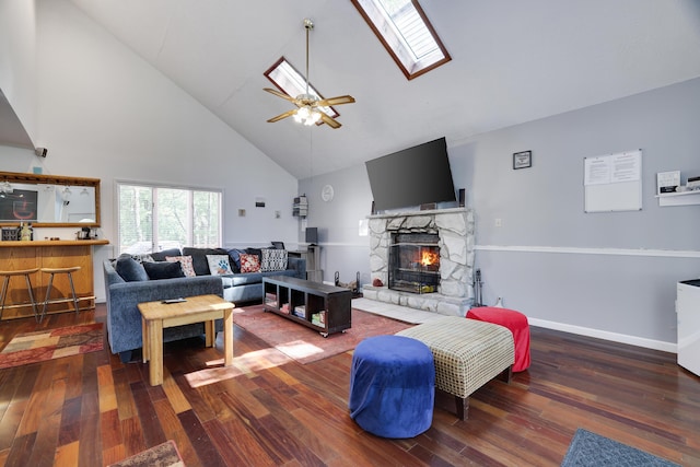 7042 Vista Dr, Tobyhanna, PA 18466 - living room with high vaulted ceiling, ceiling fan, wood finished floors, a fireplace, and a skylight