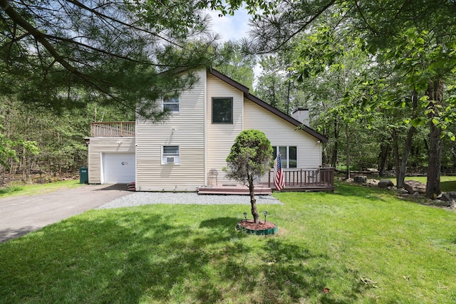 7042 Vista Dr, Tobyhanna, PA 18466 - view of home's exterior with driveway, a chimney, a yard, a wooden deck, and a garage