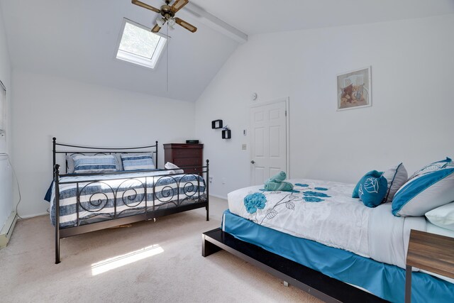 7042 Vista Dr, Tobyhanna, PA 18466 - carpeted bedroom featuring a skylight, beam ceiling, a ceiling fan, and high vaulted ceiling