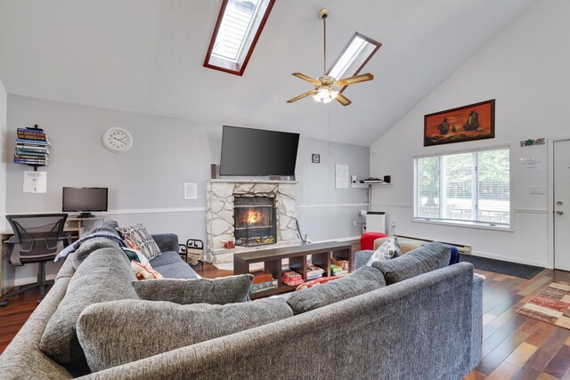 7042 Vista Dr, Tobyhanna, PA 18466 - living room featuring high vaulted ceiling, a stone fireplace, wood finished floors, a skylight, and ceiling fan