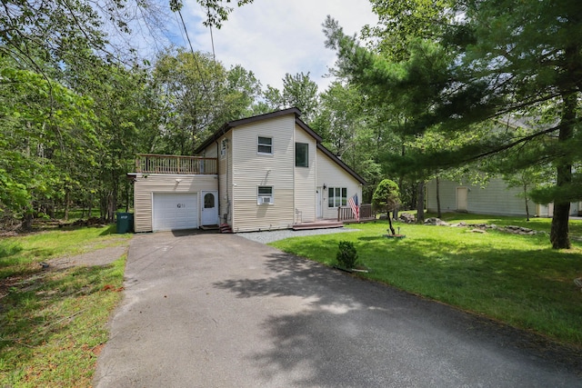 7042 Vista Dr, Tobyhanna, PA 18466 - view of front of property featuring asphalt driveway, a front lawn, a wooden deck, and an attached garage