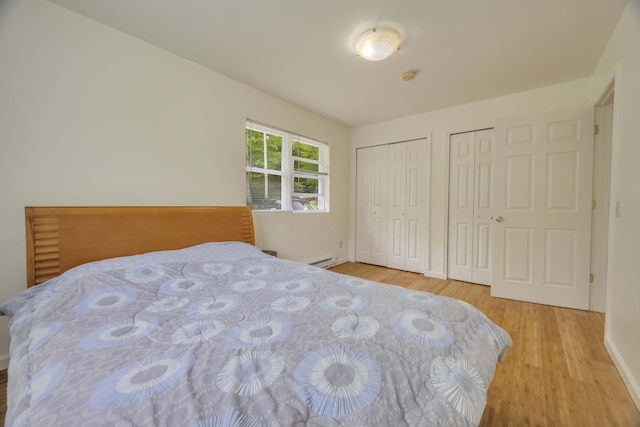 233 Vista Rd, Cresco, PA 18326 - bedroom with two closets, wood finished floors, and baseboard heating