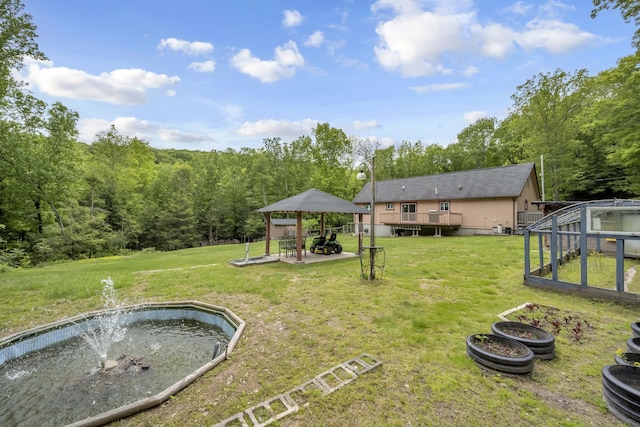 233 Vista Rd, Cresco, PA 18326 - view of green lawn with a gazebo, a forest view, a greenhouse, and a wooden deck