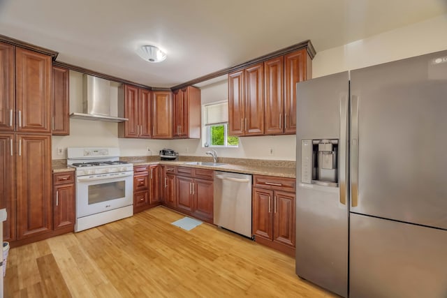 233 Vista Rd, Cresco, PA 18326 - kitchen with appliances with stainless steel finishes, wall chimney exhaust hood, brown cabinets, and light wood-style flooring
