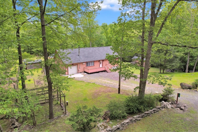 233 Vista Rd, Cresco, PA 18326 - view of front of property with a wooden deck, dirt driveway, an attached garage, and a wooded view