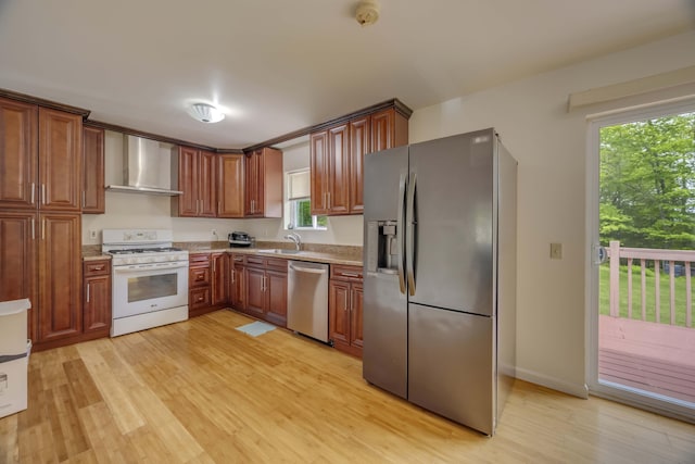 233 Vista Rd, Cresco, PA 18326 - kitchen with appliances with stainless steel finishes, wall chimney range hood, light wood finished floors, and brown cabinets