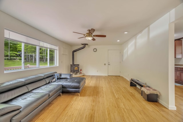 233 Vista Rd, Cresco, PA 18326 - living room with a wood stove, light wood finished floors, a ceiling fan, and recessed lighting