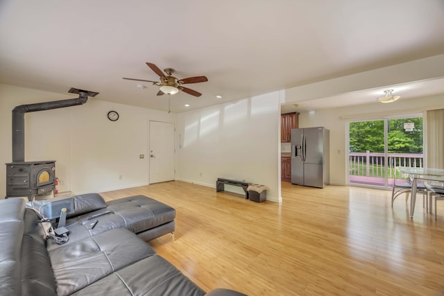 233 Vista Rd, Cresco, PA 18326 - living area featuring a wood stove, a ceiling fan, light wood-style flooring, and recessed lighting