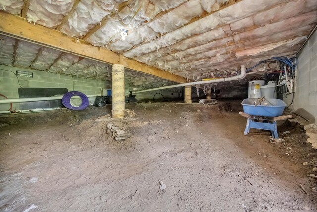 233 Vista Rd, Cresco, PA 18326 - inside crawl space featuring water heater and concrete block wall