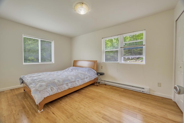 233 Vista Rd, Cresco, PA 18326 - bedroom featuring a baseboard radiator and light wood-type flooring