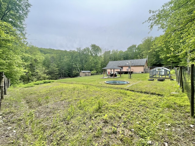 233 Vista Rd, Cresco, PA 18326 - view of yard featuring an exterior structure, an outdoor structure, and a forest view