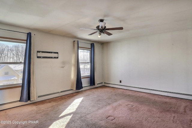 unfurnished room with ceiling fan, light colored carpet, and a healthy amount of sunlight