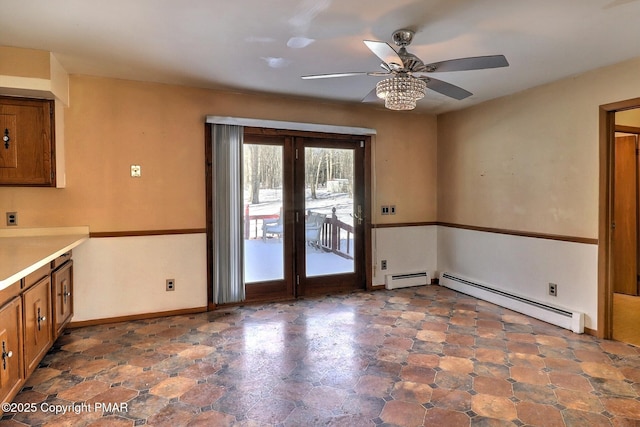 interior space featuring a baseboard radiator and ceiling fan