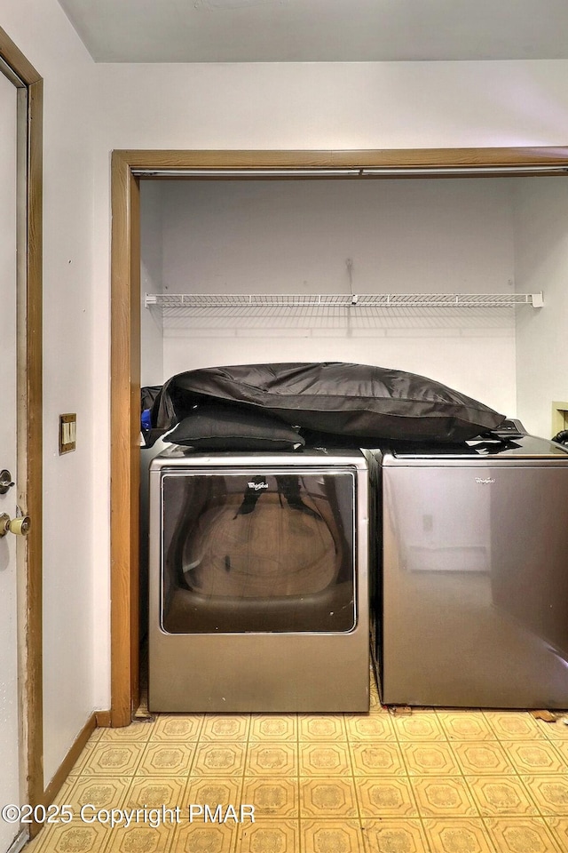 laundry room with washer and clothes dryer