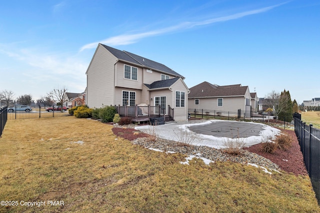 rear view of house featuring a pool side deck, a yard, and a patio area